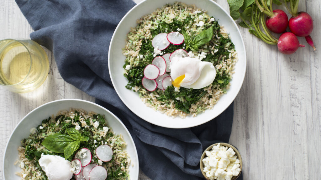 Kale and radish rice bowl with arugula and basil pesto