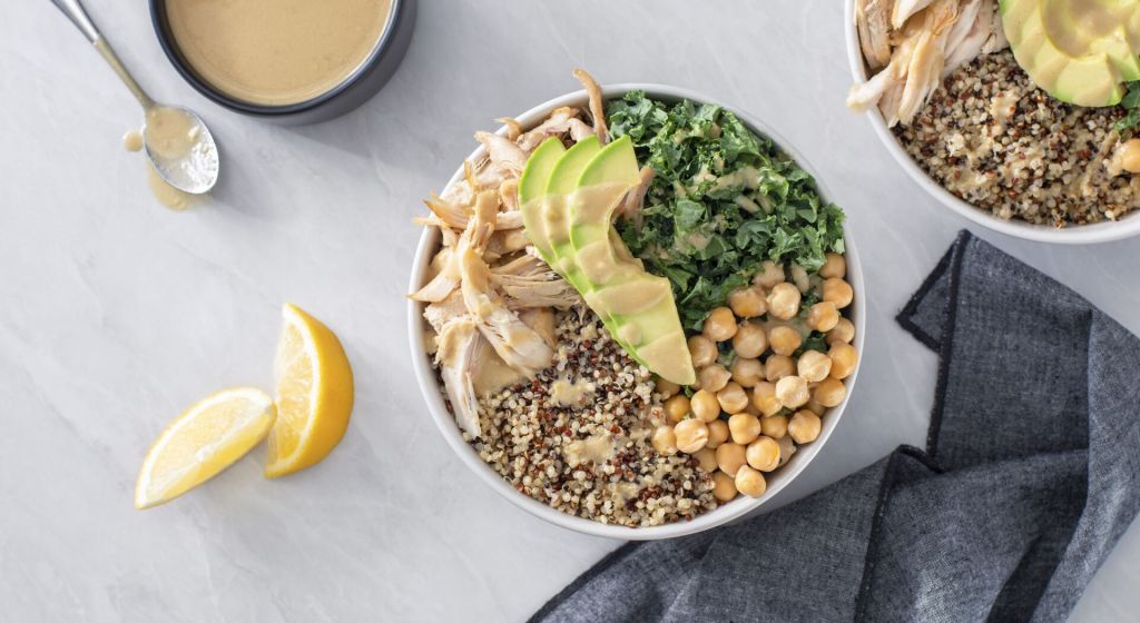 Chicken and quinoa power bowl with tahini caesar dressing