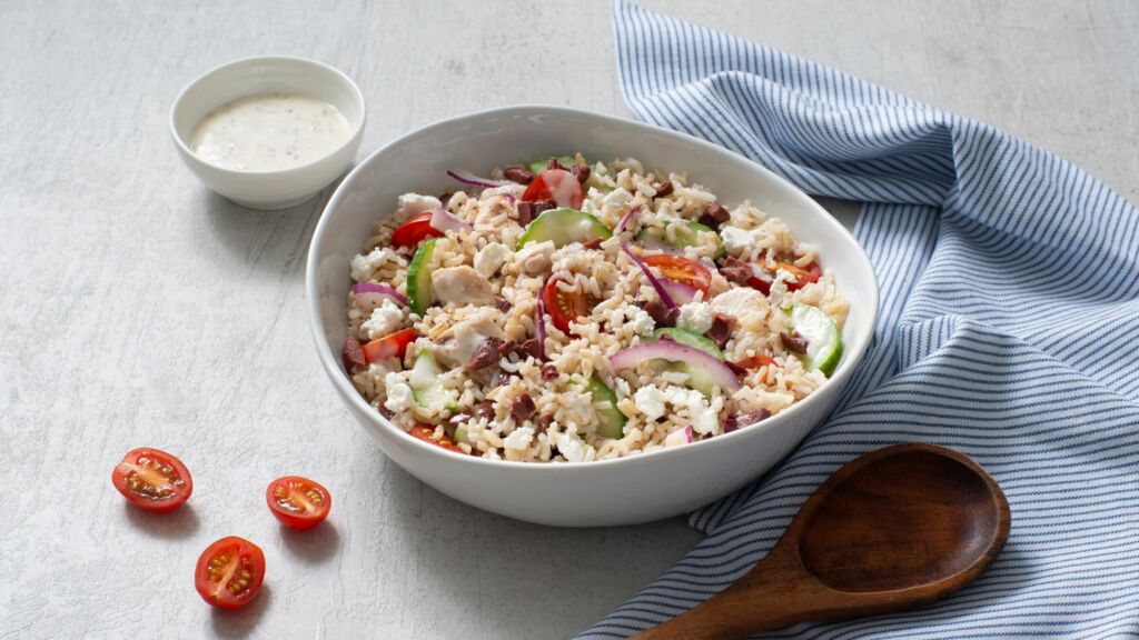 chicken-and-rice-salad-with-caesar-dressing-cherry-tomatoes-olives-red-onion-and-cucumber