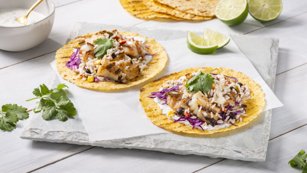 baja-fish-tacos-with-white-rice-black-beans-corn-bell-peppers-and-cilantro-cream